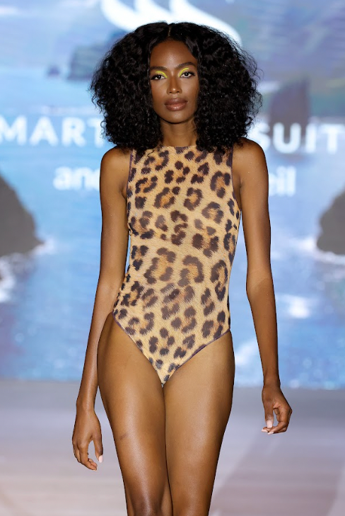 Explore sustainable tan-through smart swimsuits with a leopard print in this file. Featuring a one-piece swimsuit, as seen in Vogue, it offers fashionable and eco-friendly beachwear options