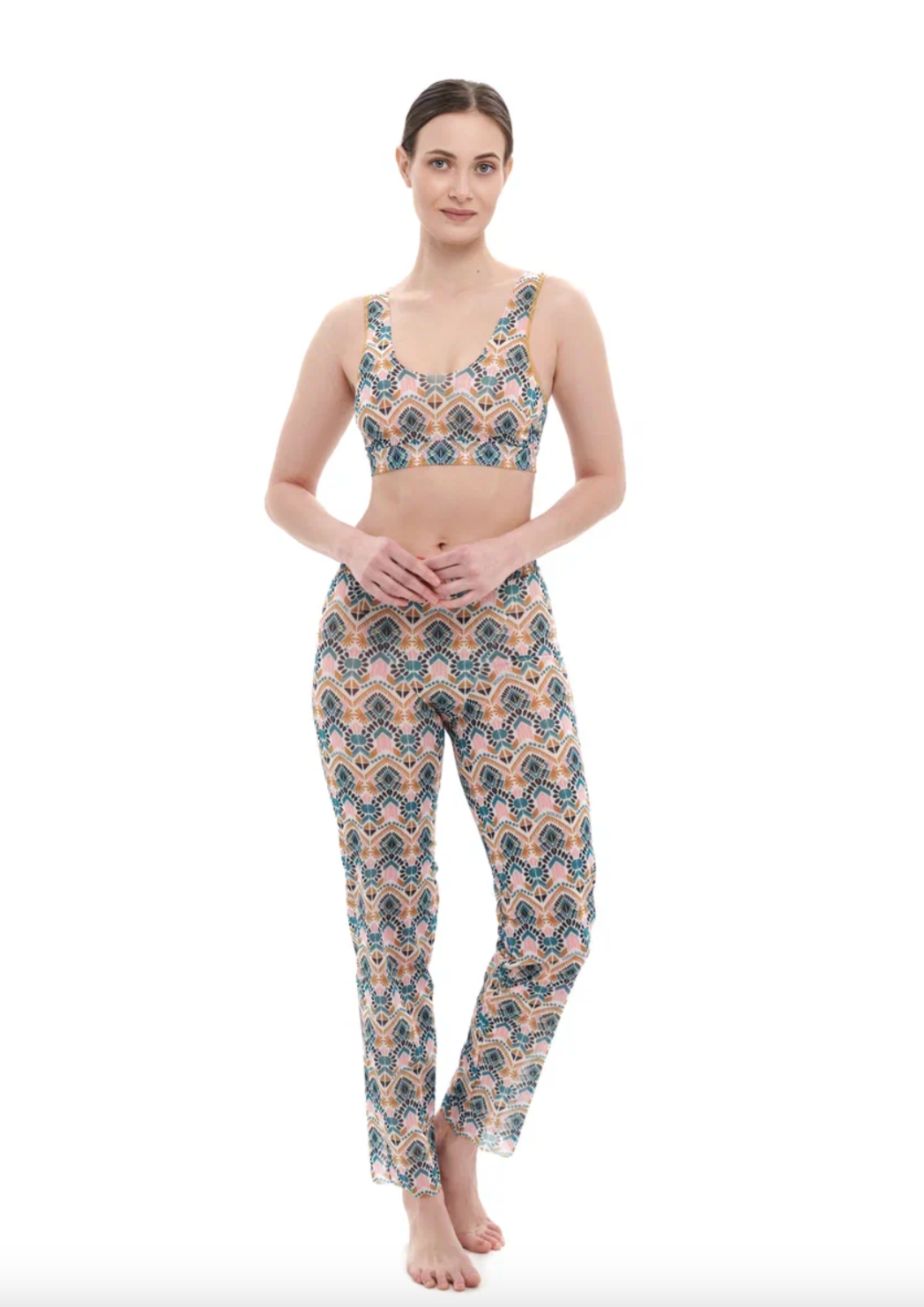This file describes a tan-through, innovative, and sustainable burkini set with a Casablanca print. The set includes a top, leggings, and a tunic, providing classic luxury for modest fashion. The description encourages shopping for this stylish and eco-friendly swimwear.