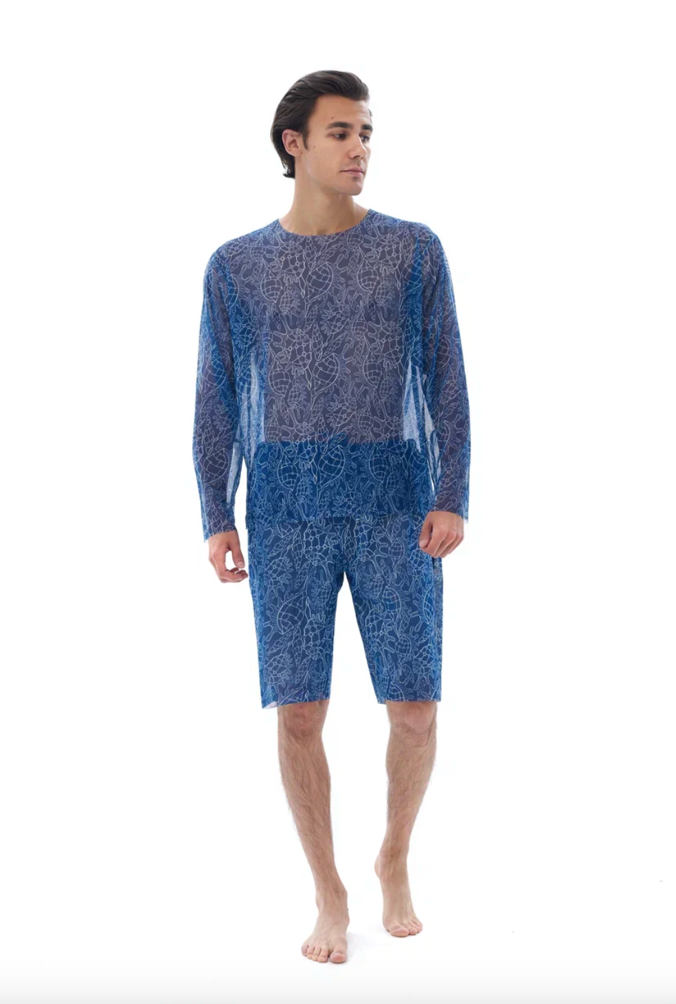 This file describes tan-through, sustainable Men's Smart Swim Trunks Bermudas in SHELLS print. It combines innovation and classic luxury for modest fashion. Shop now!