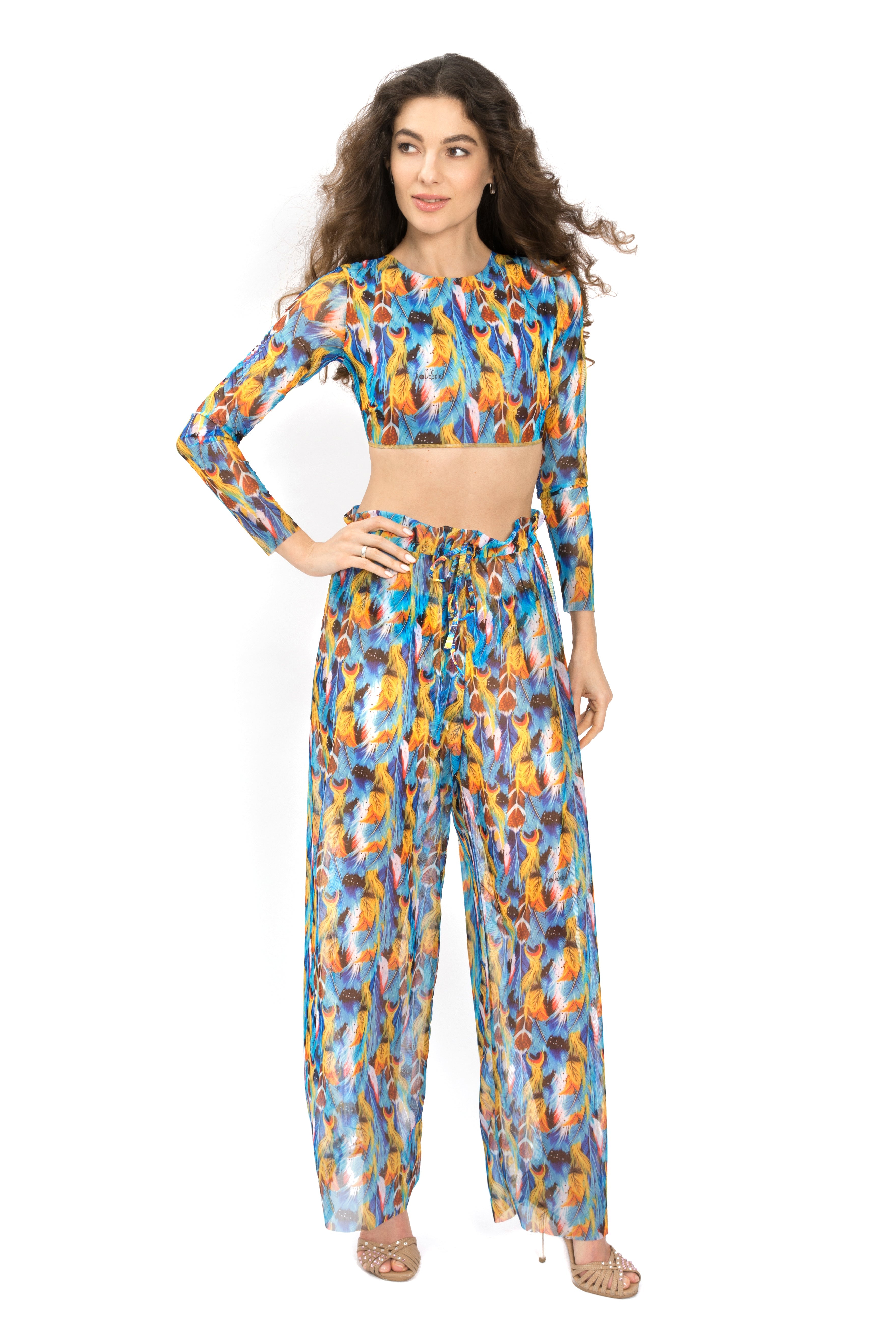 Explore our luxury smart swimsuits collection featuring a chic feather print. Crafted with tan-through fabric and SPF 15 protection, these beach pants offer comfort and style for your summer adventures