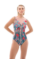 Discover the epitome of elegance in our collection of tan-through smart swimsuits. With a fairy tale print and sleeveless one-piece design, experience luxury and sustainability in every swim.