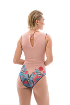 Discover timeless elegance with our tan-through smart swimsuits showcasing a fairy tale print. Embrace luxury in a sleeveless one-piece design. Take action now for a sustainable and sophisticated beachwear experience.