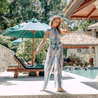 This file presents sustainable tan-through smart swimsuits adorned with a stylish Jellyfish print. Included are beach pants offering both luxury and sun protection.