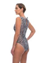 This file showcases sustainable tan-through smart swimsuits adorned with a trendy Fake Zebra print. Featuring sleeveless one-pieces, they offer sun-safe sophistication.