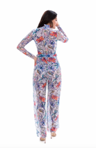 This file showcases tan-through sustainable smart swimwear adorned with a dragonflies print. Featuring beach pants, as seen at Hawaii Fashion Week, it offers stylish and eco-friendly beach attire options.