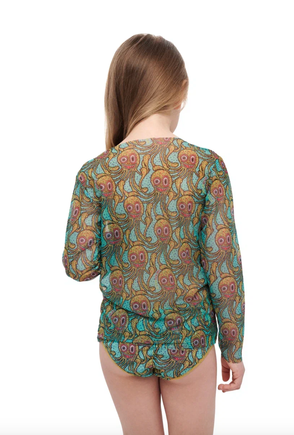 This file contains a description of a tan-through, sustainable kid's T-shirt and shorts set with an Octopus print. It combines innovation and classic luxury for modest fashion. Shop now!