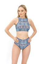 Explore our file featuring Tan Through Smart Swimsuits in a Tie-Dye print. With high waist bikini bottoms, it offers a perfect fit and SPF35 protection. Timeless style meets innovative sustainability