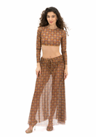 This file offers a concise overview of a sustainable smart swimwear product: the Africa print beach skirt. With SPF 15 protection and tan-without-tan-lines technology, it's a stylish option for beachgoers